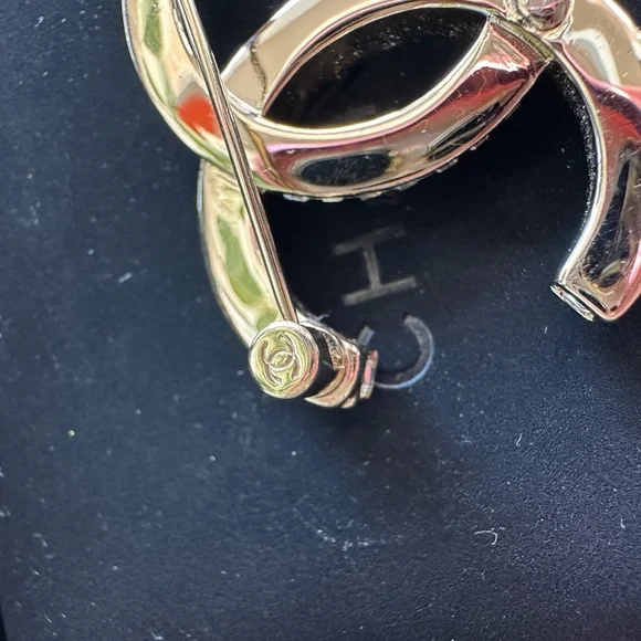 Chanel Silver Crystal Logo Brooch